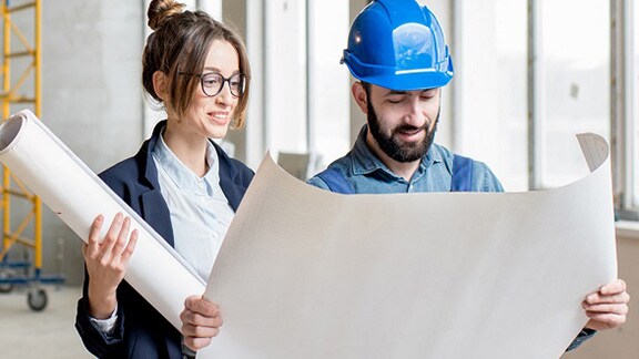 man-and-woman-looking-chart