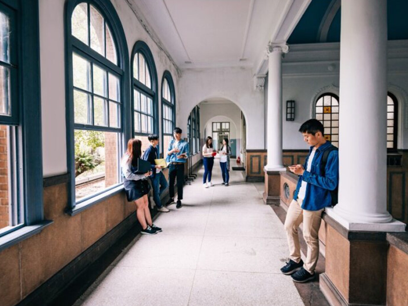 A group of people standing in a hallway