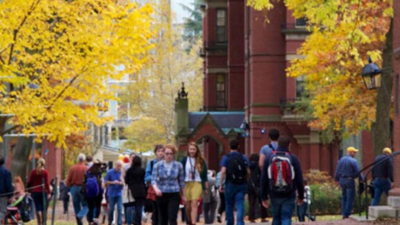 Students walking across a university campus