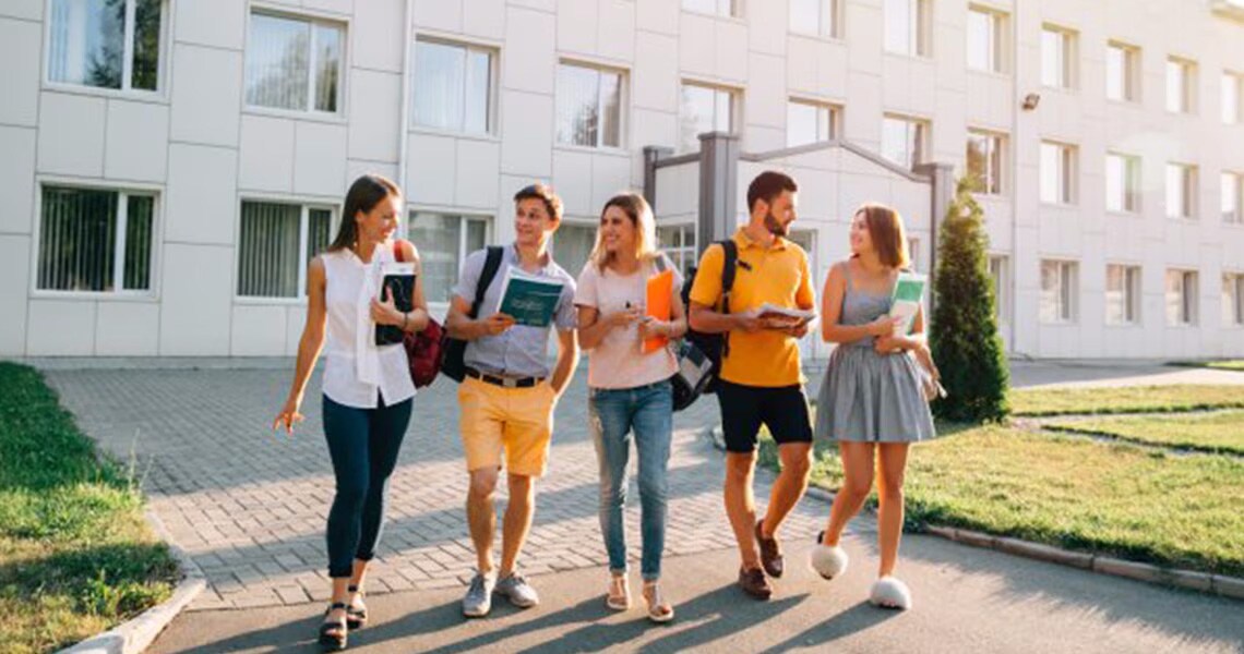 College students chatting and walking along their campus