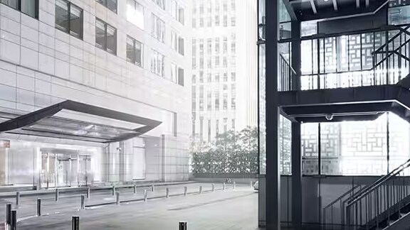 Grayscale image of the parking lot stairwell outside a commercial building