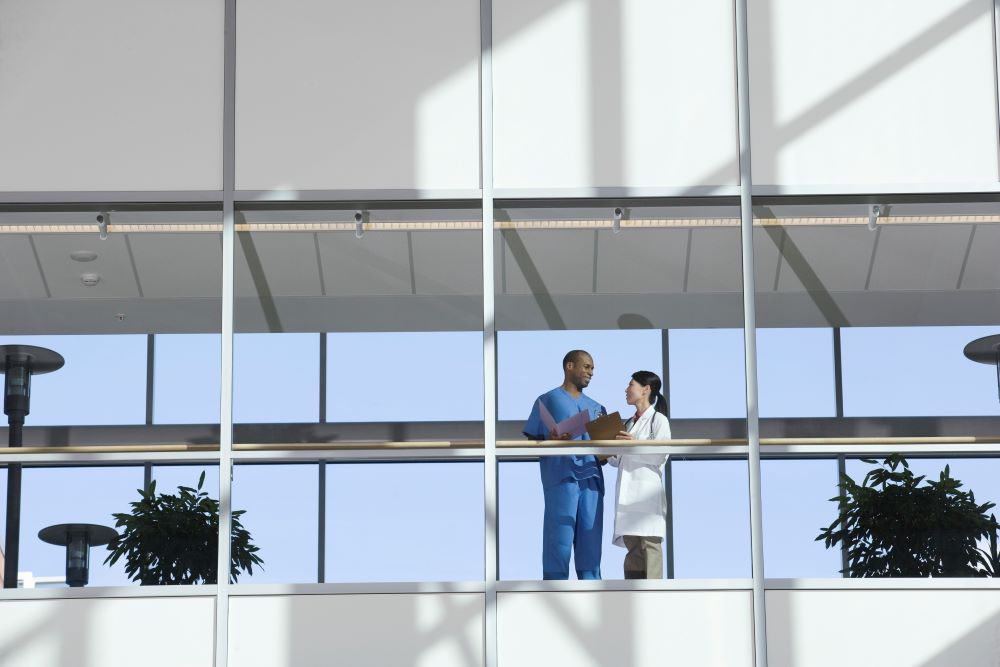 Two people standing in the hospitak