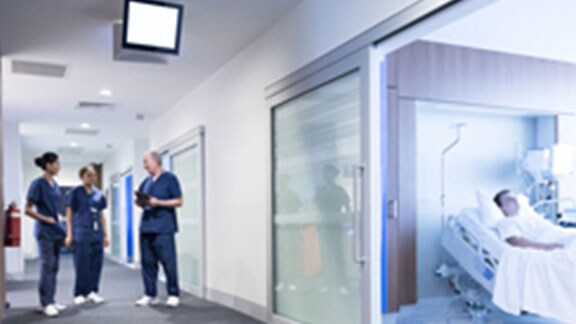 healthcare professionals in hospital corridor