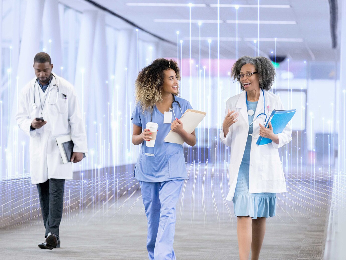 Two lady doctors walking on floor having graphics in background