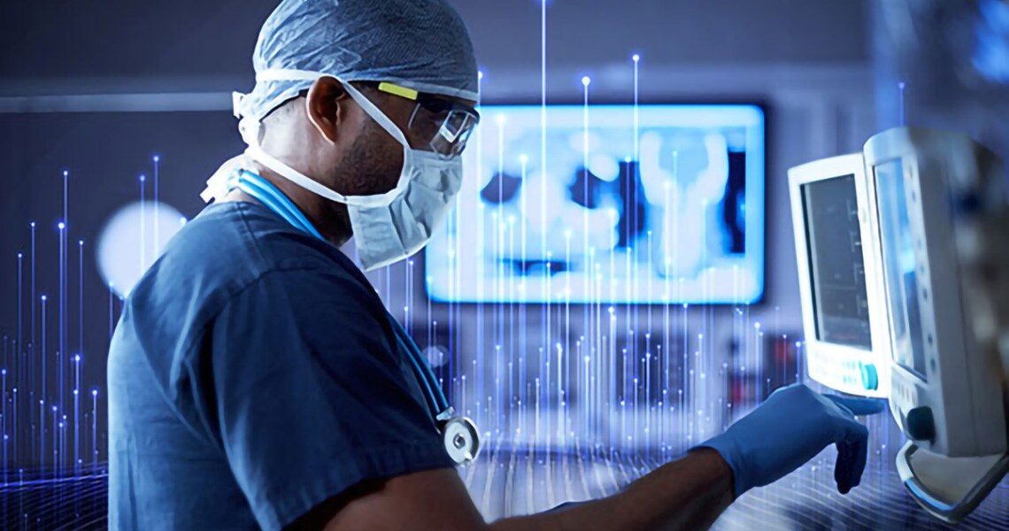 Side view of a healthcare worker operating a ECG machine