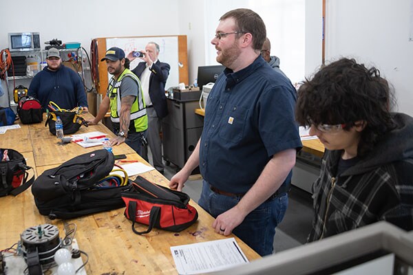 Students demonstrating what they have learned in programs benefiting from Johnson Controls Community College Partnership Program.