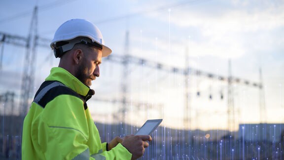 Engineer using a tablet in a power plant