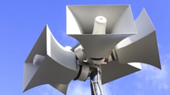 five megaphones attached to pole